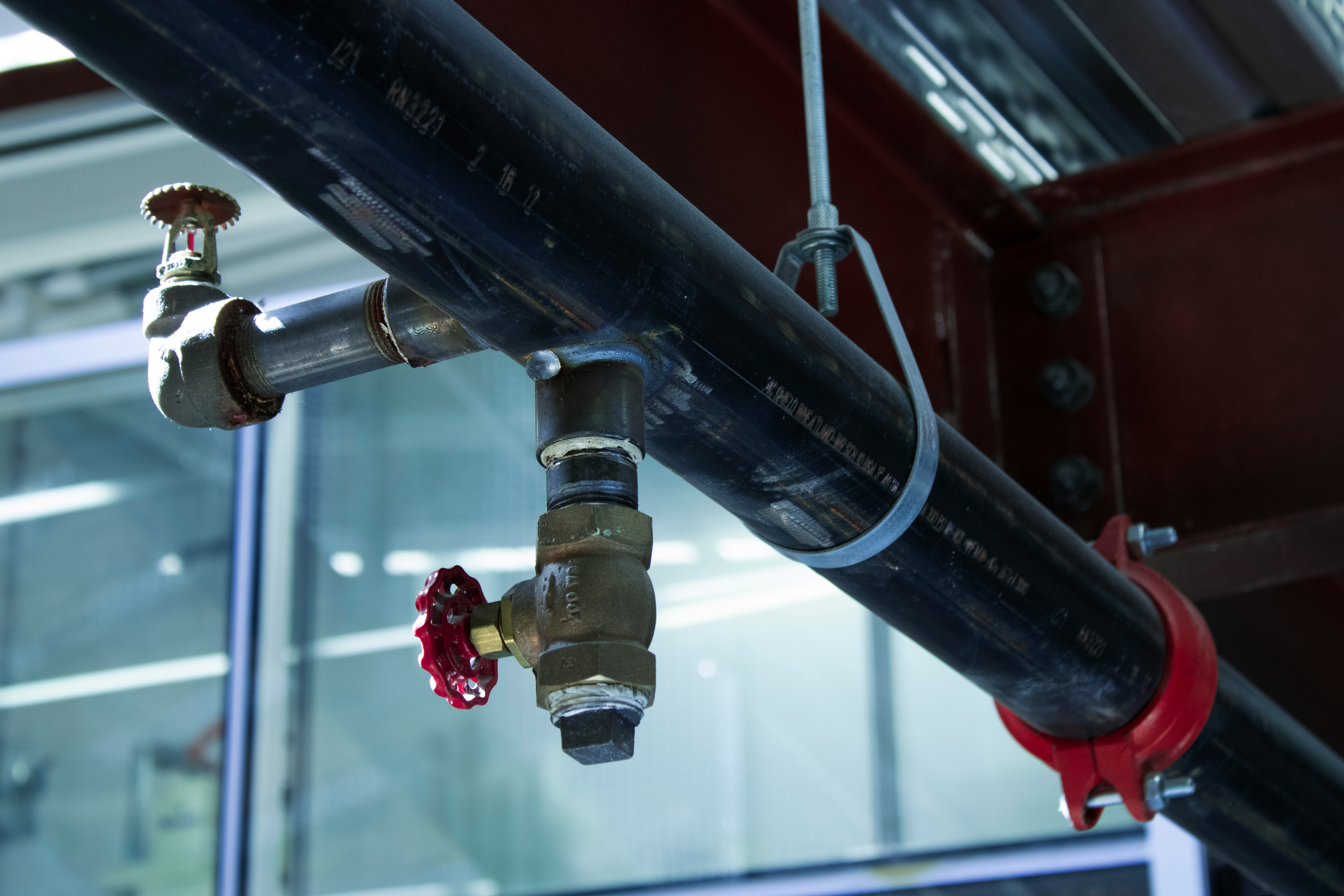 Plumber at work - subscribe to The Pipeline newsletter for plumbing code tips